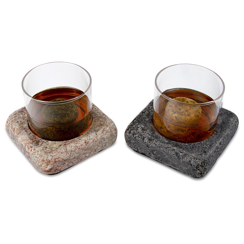 Pair of whiskey glasses in stone bases with chilling rocks, designed to keep drinks cold without dilution