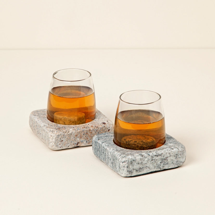 Pair of wine glasses set in square stone bases with chilling rocks, keeping drinks cool with a rustic, stylish design