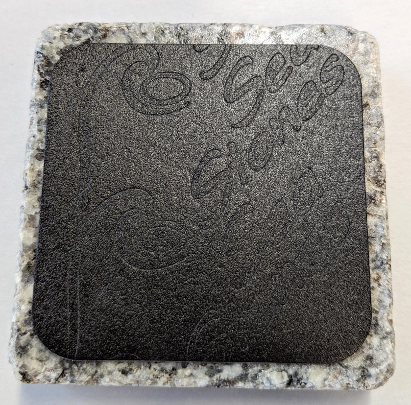 Close-up of the underside of a granite drink chiller base, showing textured grip for stability and durability