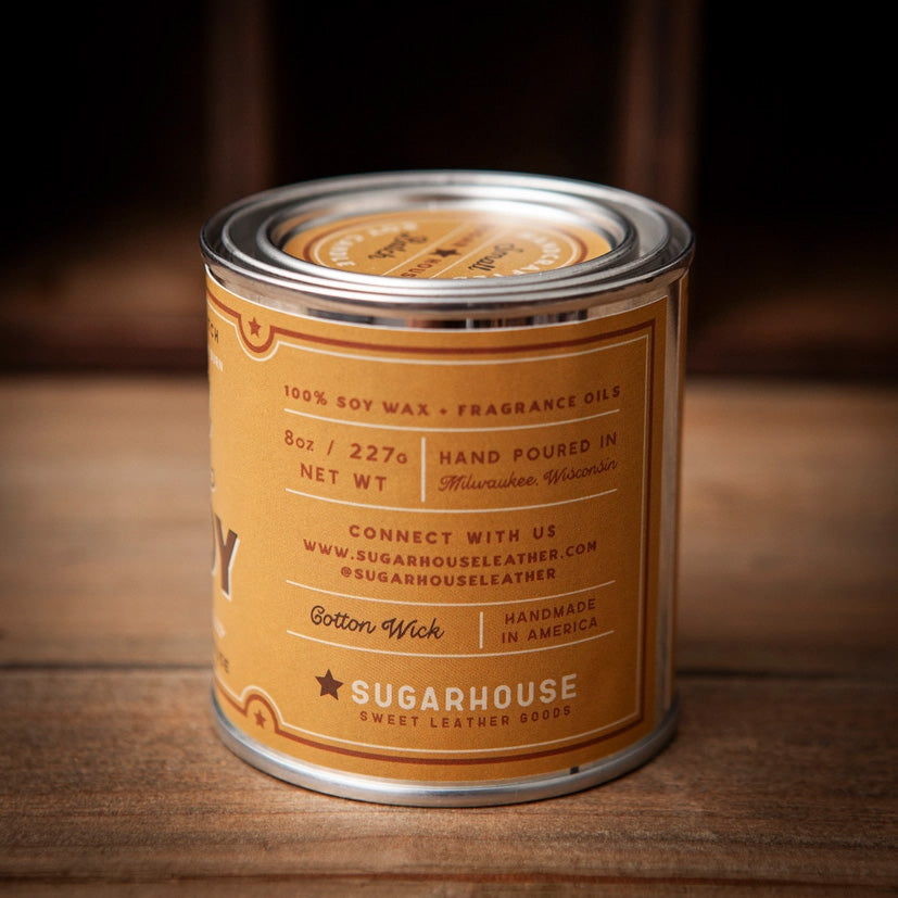 Yellow Sugarhouse soy candle tin showing back label details: 100% soy wax with fragrance oils, 8oz / 227g, hand poured in Milwaukee, Wisconsin, with cotton wick, handmade in America branding